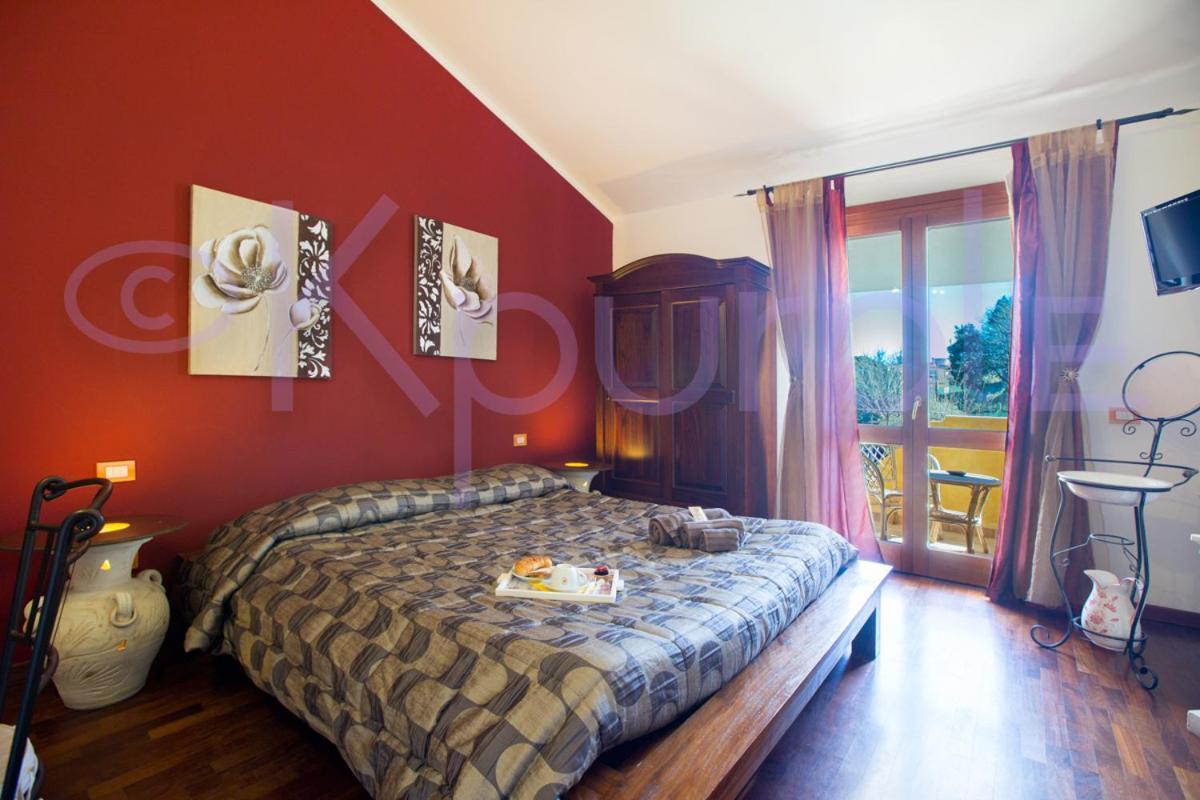 Le Api Hotel กาญารี ภายนอก รูปภาพ